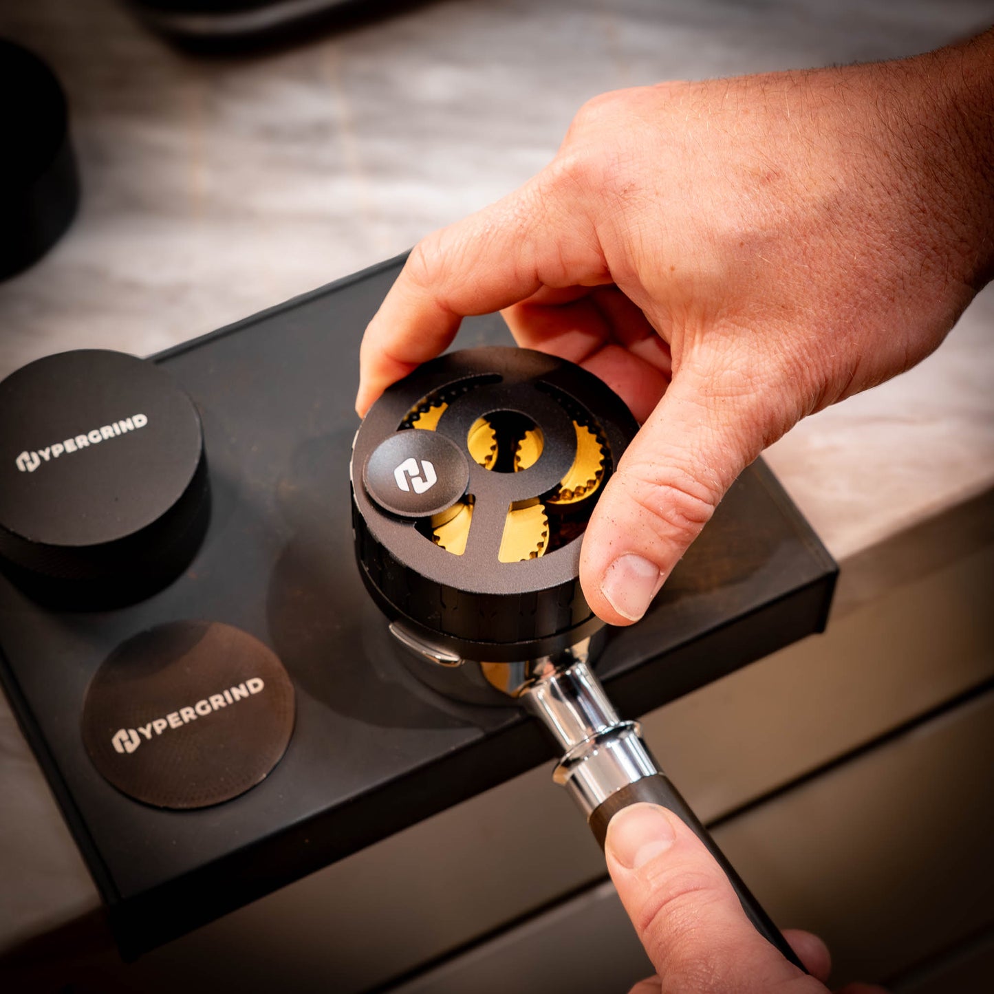 Nexus rotary WDT tool being used to distribute coffee grounds in a portafilter